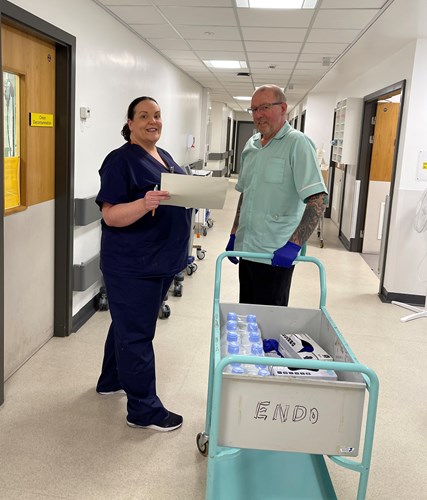 WUTH Photo of a nurse and a housekeeper on the corridor