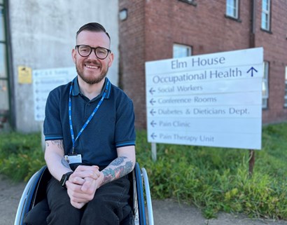 Photo of Mark Ireland who is a male wearing glasses sitting in a wheelchair